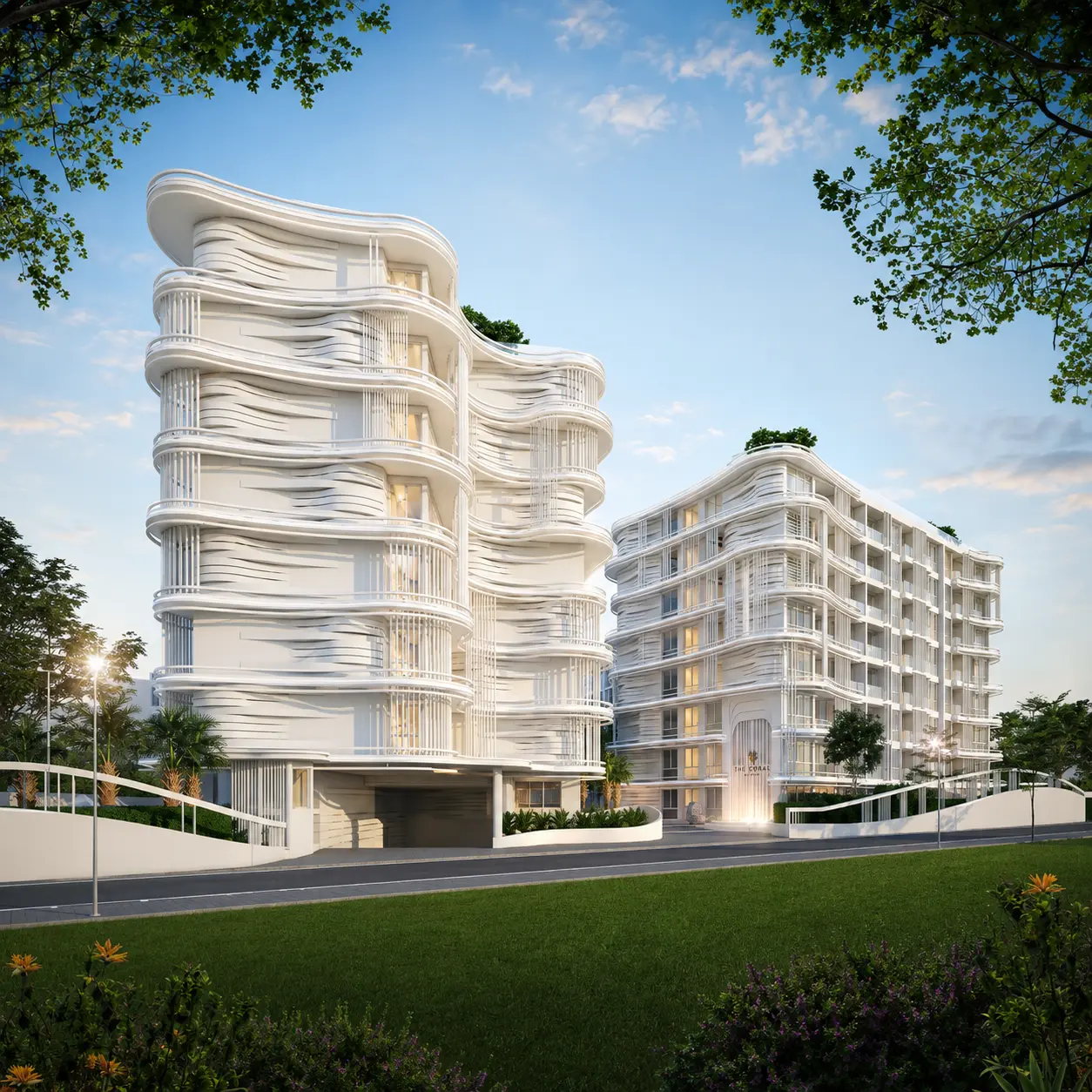 Wave-shaped white buildings of The Coral Pattaya at sunset